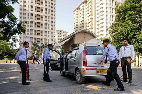 security guards conduct a security check on a vehicle